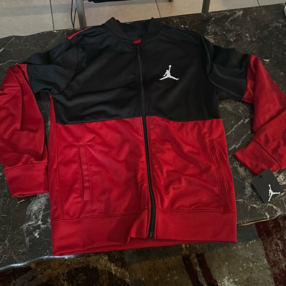 Size large boys Jordan jacket never used.